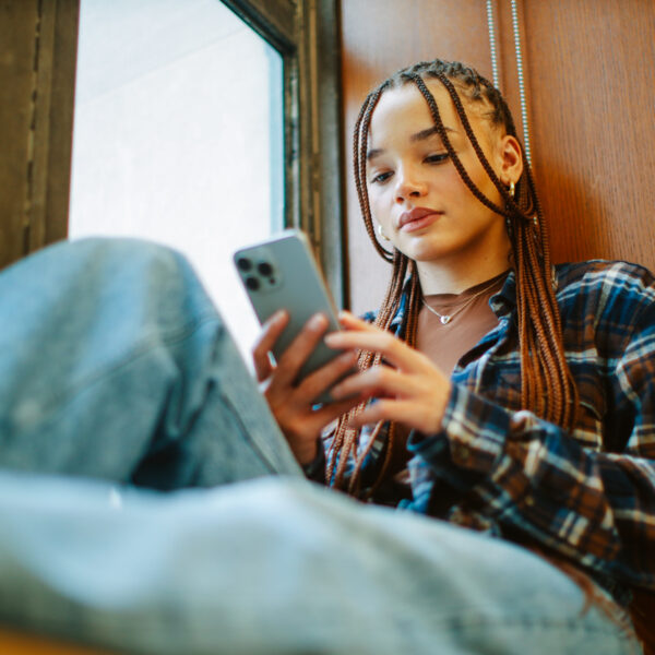 student texting on her phone